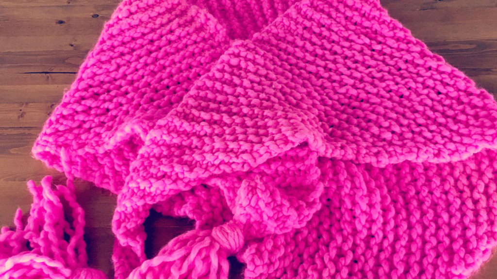 This bright and fun shawl knit up in no time and really cheered up my drab hospital room with it's hot pinkness!
