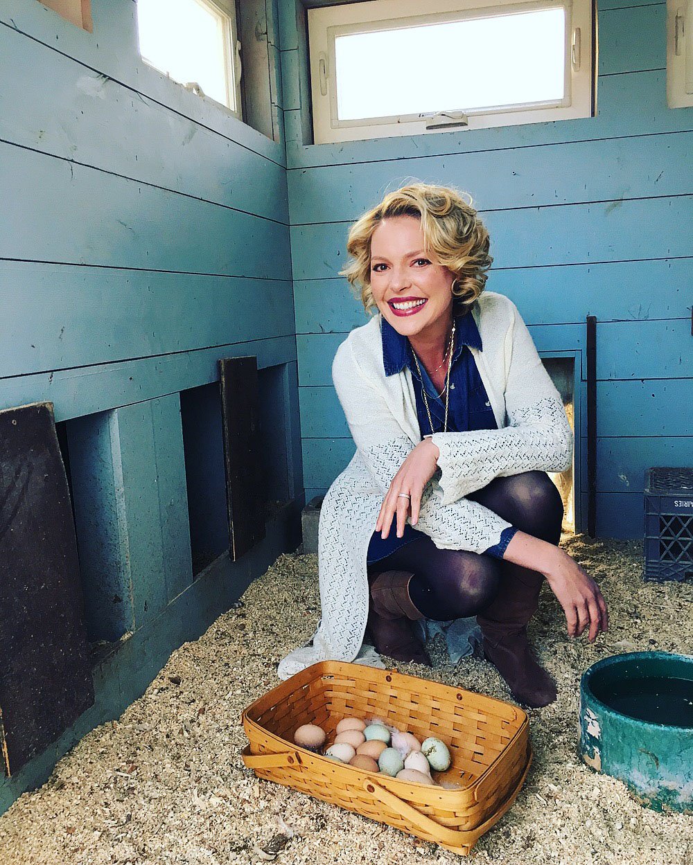 Katherine Heigl collecting eggs from her chicken coop