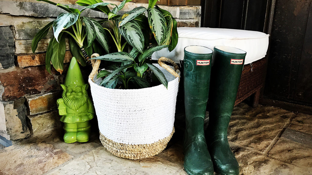 The opposite corner was looking a bit bare so I grabbed the wicker ottoman that goes with the arm chair and threw a potted plant, a silly green garden gnome I've had since last year and my green hunter boots in front of it to create a spot for pulling those boots on and off.