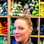 Katherine Heigl Standing In Front Of Colored Yarns