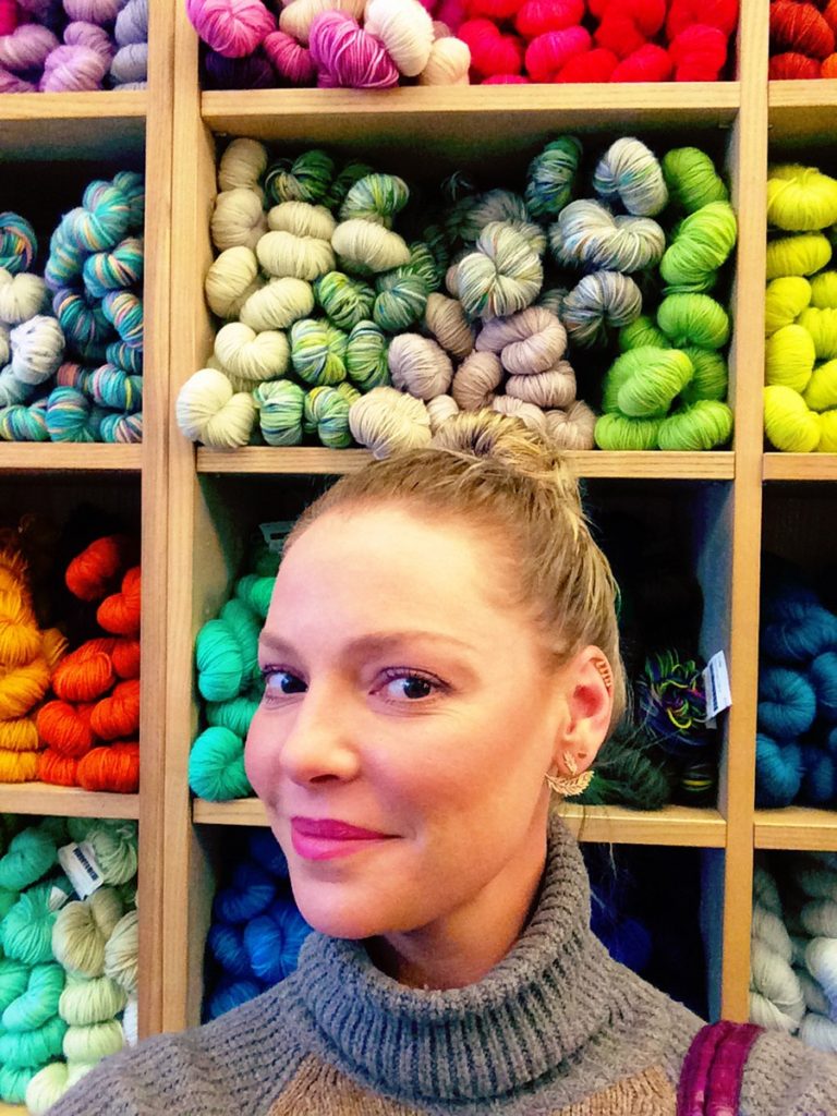 Katherine Heigl Standing In Front Of Colored Yarns