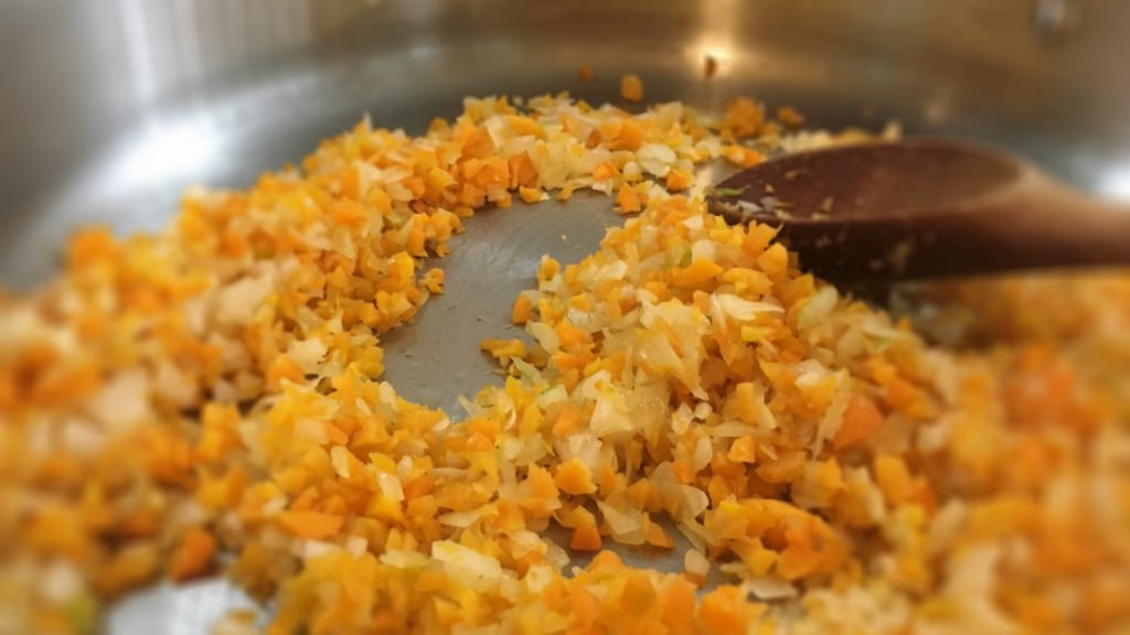 Carrots, onions and garlic sautéing