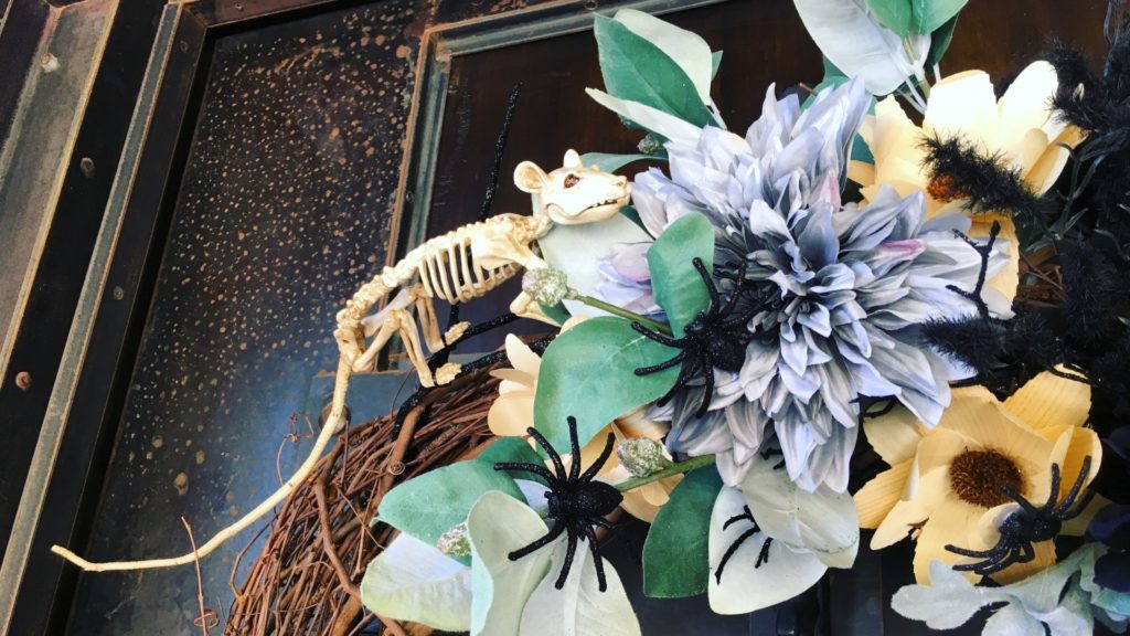 Spooky wreath with creepy crawlies and skeletons