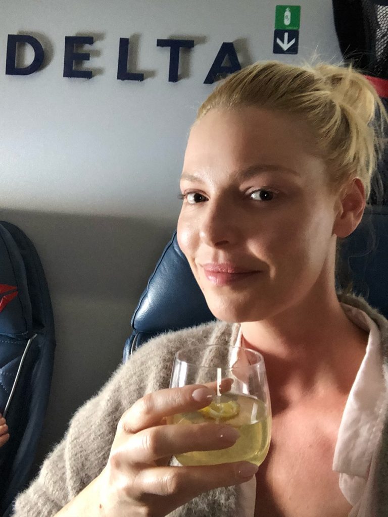 Katherine Heigl enjoying a cocktail on her flight