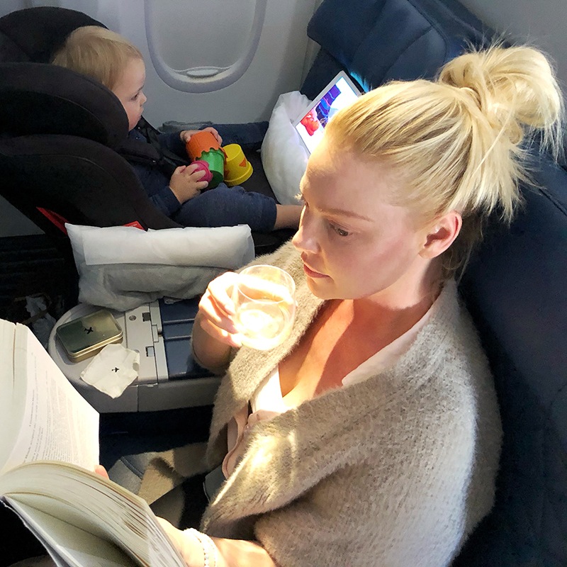 Katherine Heigl reading and enjoying a cocktail while Joshua Jr. plays with his toys